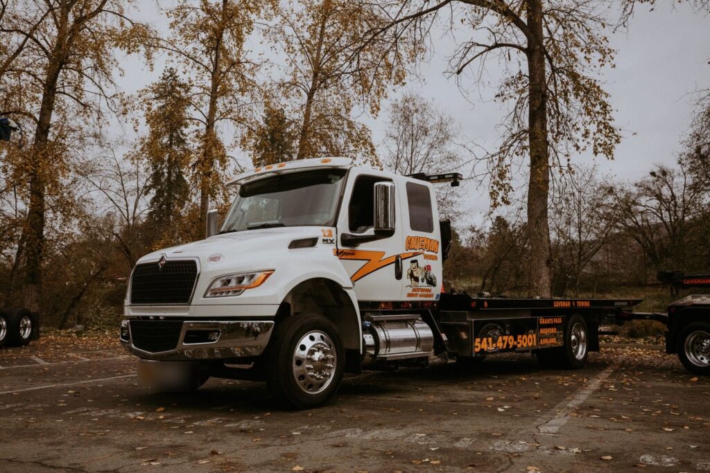 Caveman Towing flatbed tow truck