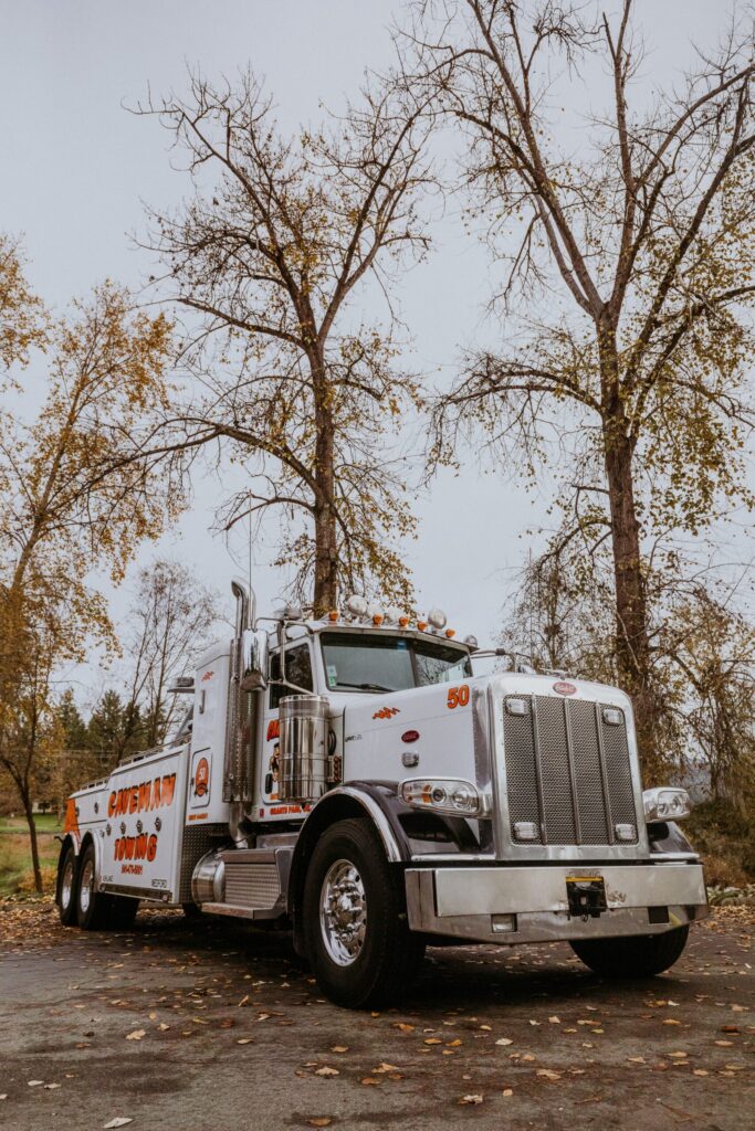 Caveman Towing heavy wrecker, front three-quarter view
