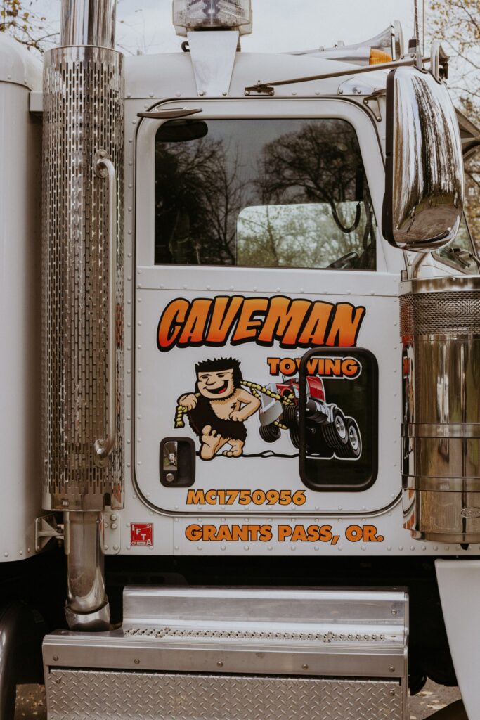 Caveman Towing logo on a truck door, Grants Pass, Oregon